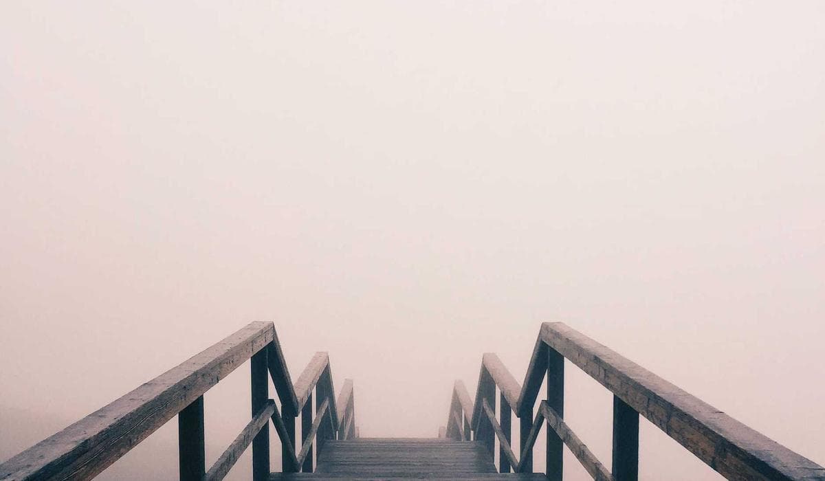 Food handler wearing gloves preparing food in a Canadian restaurant kitchen