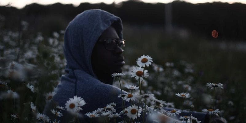 Newlywed couple walking together on a scenic path