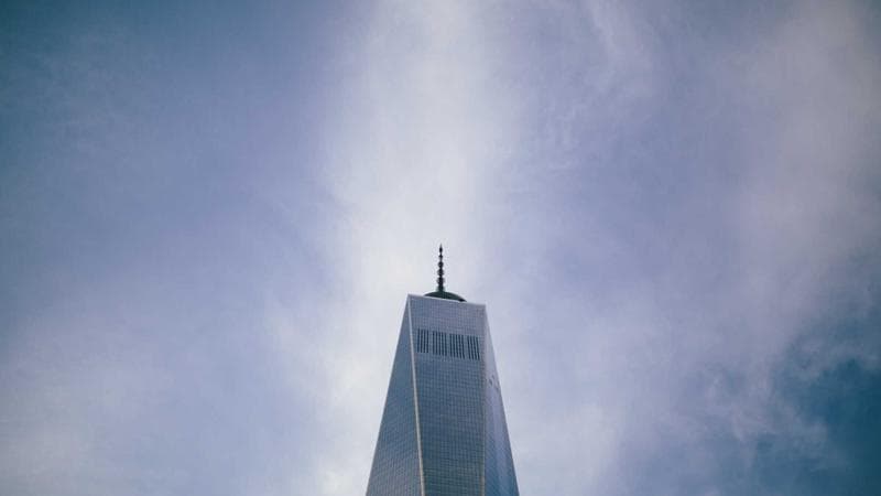 Person reviewing educational documents and transcripts for credential assessment