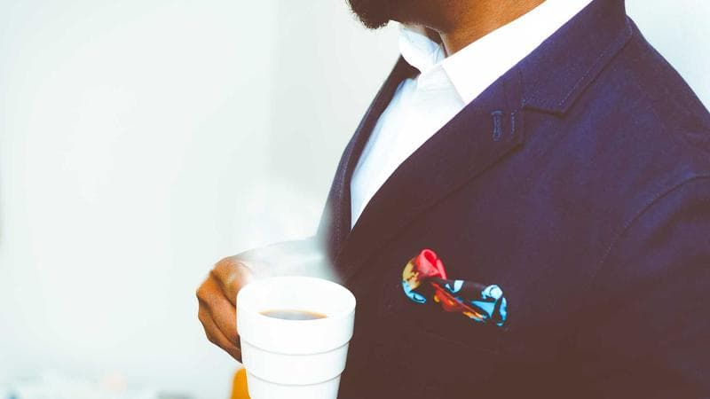 Person holding a smartphone displaying a Canadian phone number setup screen