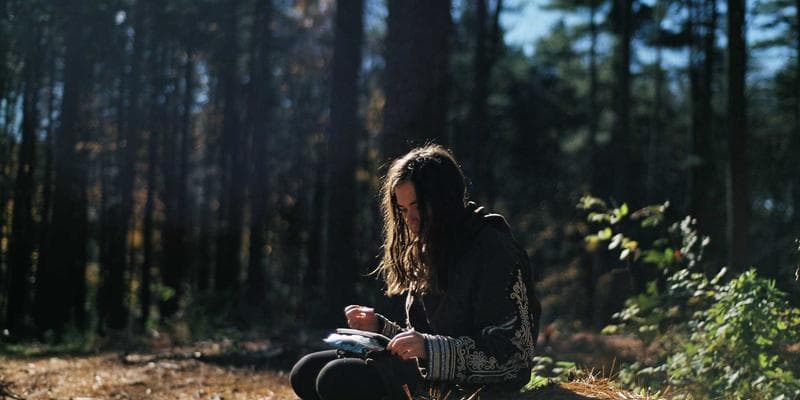 Small business owner in a Canadian shop setting up their point-of-sale system for tax collection