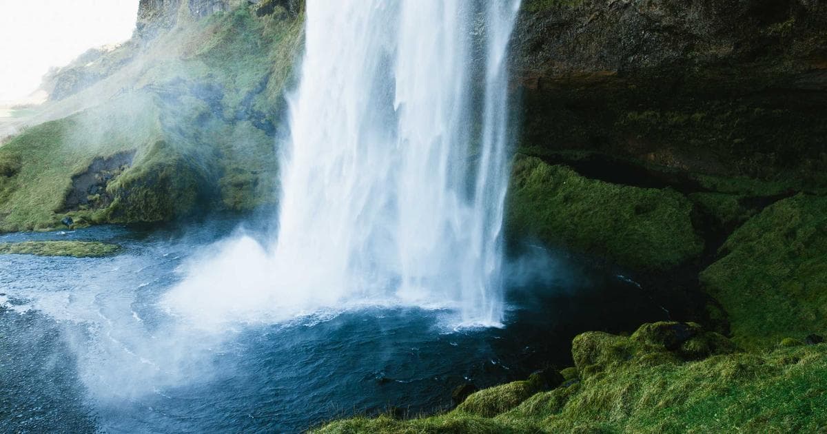 Documents and a pen on a table, representing the BC income assistance application process.
