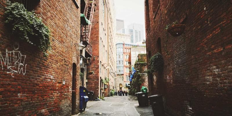 Two people shaking hands in a community support setting