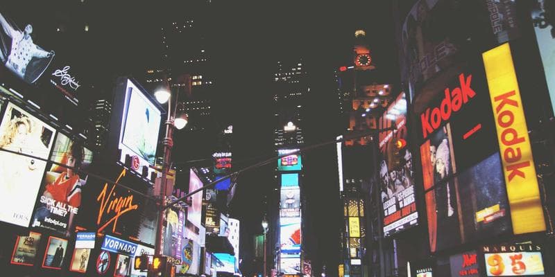 Entrepreneur signing business registration paperwork at a desk