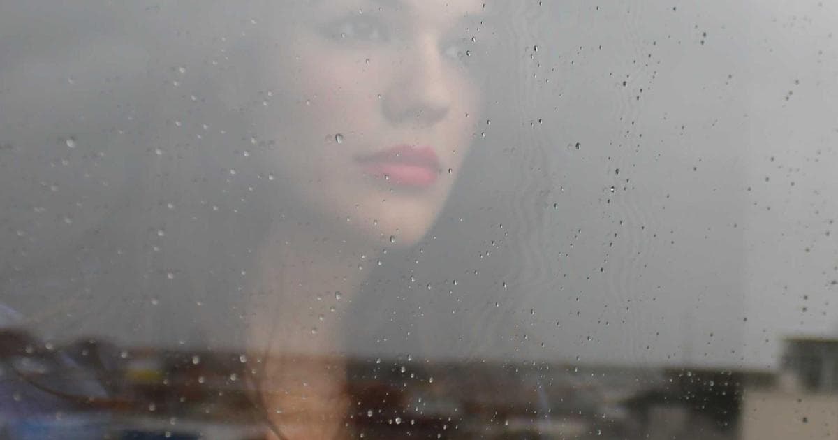 Person in a wheelchair looking at an application form, symbolizing BC disability assistance application.