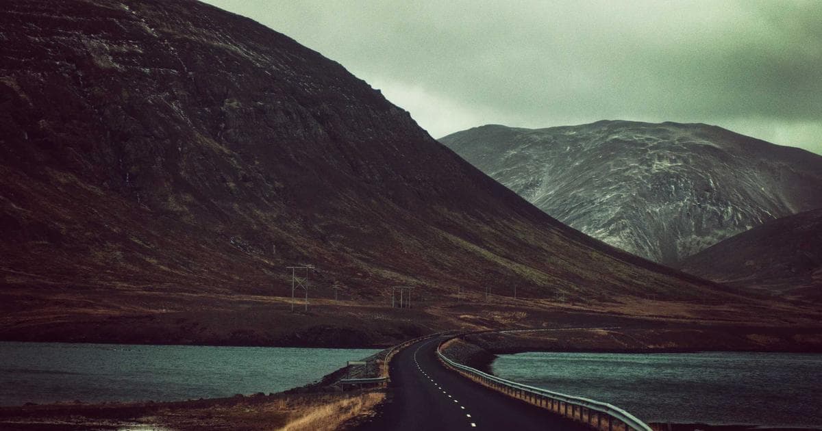 Person holding official Canadian documents needed for a SIN application