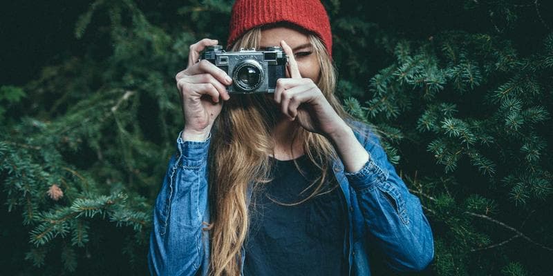 Newcomer reviewing official tax paperwork and checklists at a desk