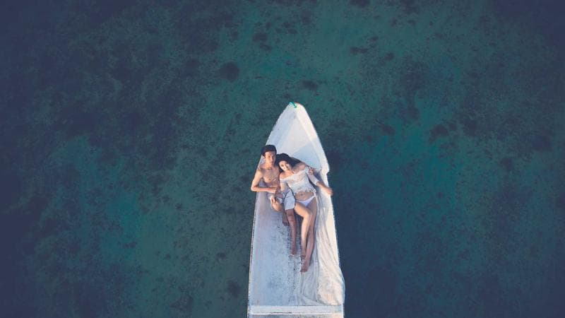 Wedding rings on a marble surface with soft natural light representing marriage in Canada