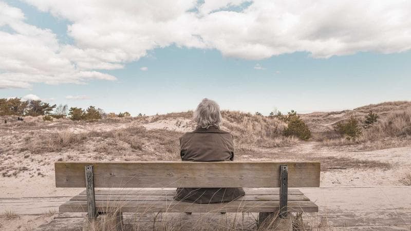 Person using a smartphone to transfer money internationally from Canada
