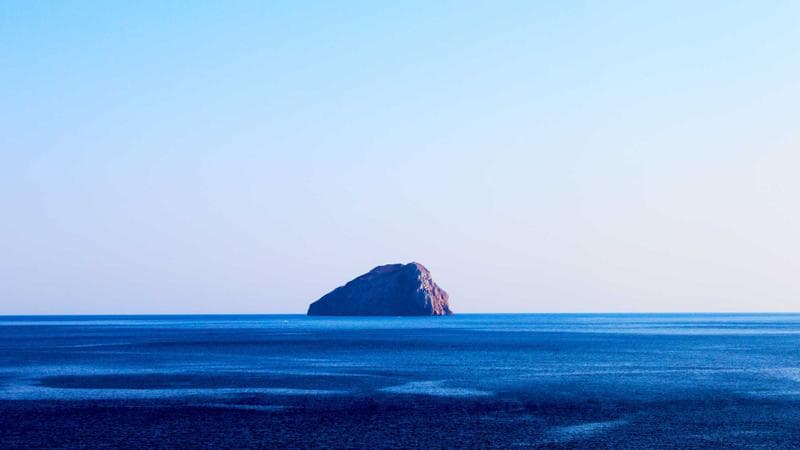 Open dictionary and coffee mug representing learning Canadian English expressions