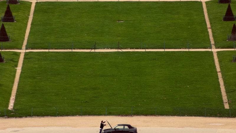 Couple walking together in a Canadian park during autumn representing dating culture in Canada