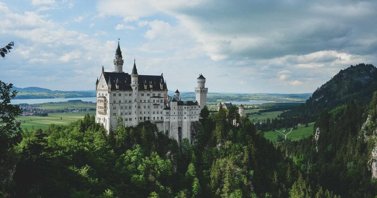 Two people reviewing immigration paperwork together at a table