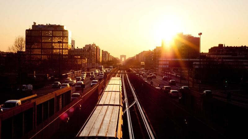 Newcomer student walking through a Canadian university campus in autumn