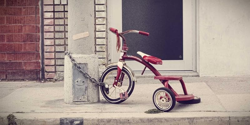 Person writing a professional resume on a laptop at a desk