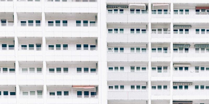 Vancouver SkyTrain passing through the city with mountain views in the background