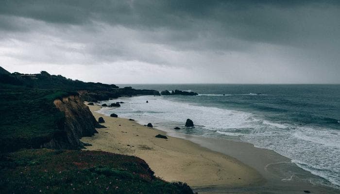 Ocean coastline near Victoria with mountains in the background