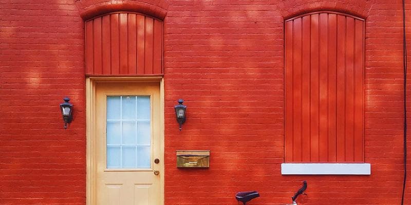 Settlement worker helping a newcomer with Canadian immigration paperwork