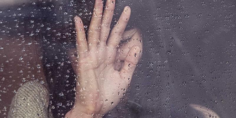A person looking at a map of Canada with business graphs overlaid, symbolizing entrepreneurship and immigration to Canada