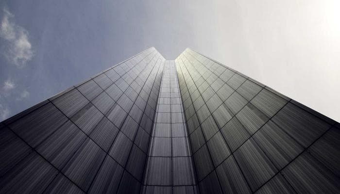 Tax documents and laptop representing online tax filing in Canada