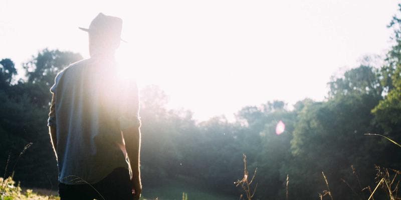 Person using a multilingual chat application on a smartphone for settlement support